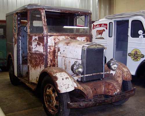 The above picture is the 1937 Divco SF truck. The side doors bi-fold along the side of the body to the rear of the side door opening. The windshield was a two piece unit, split in half top to bottom and could be opened to let in fresh air.